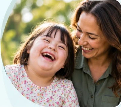 A smiling participant and her support worker outdoors